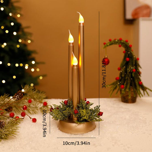Gold LED taper candles with evergreen wreath and red berry accents on round base