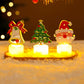 Three LED Christmas character candle lights with warm glow on a round tray