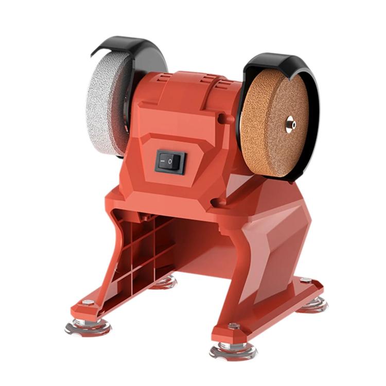 Red small bench grinder with two abrasive wheels and black safety guards
