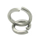 Stacked stainless steel spring split lock washers, polished silver metal