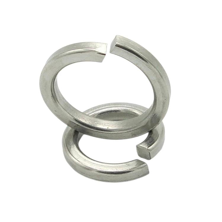Stacked stainless steel spring split lock washers, polished silver metal