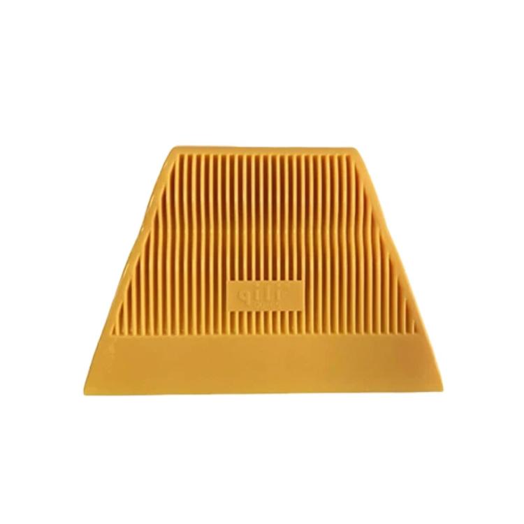 Yellow window tinting squeegee with ribbed vertical grooves and flat scraper edge.