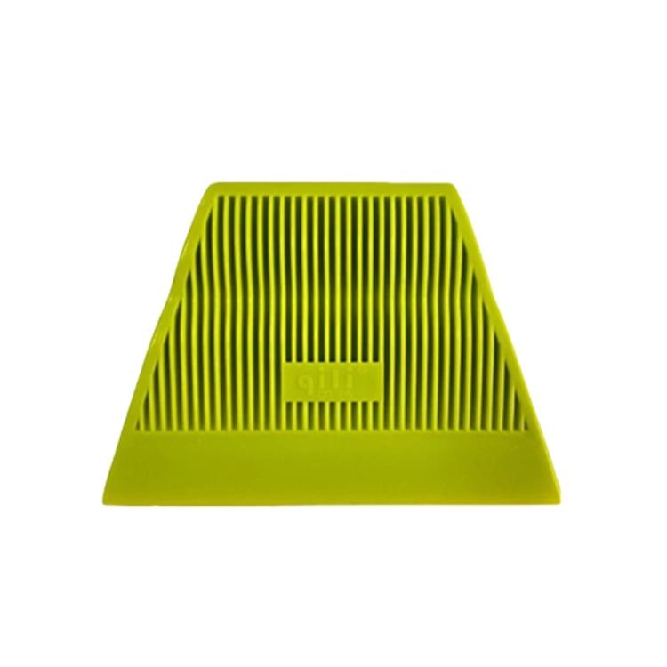 Green window tinting squeegee with ribbed vertical grooves and flat scraper edge.