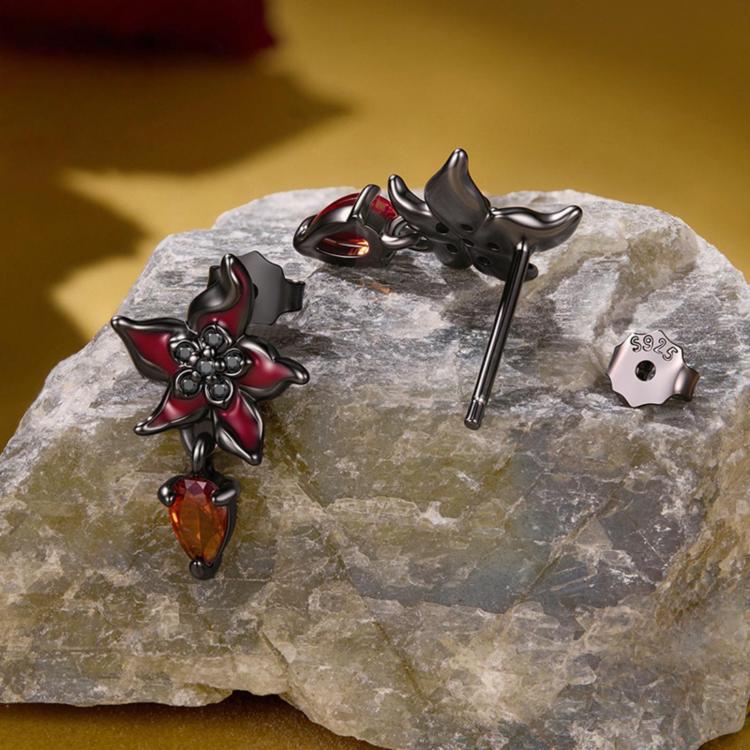 Gothic flower earrings with black finish, red petals, and amber teardrop charms