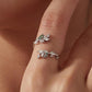 Sterling silver open leaf ring with green agate and crystal detailing on hand
