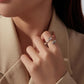 Sterling silver open leaf ring with green agate and crystal accents worn