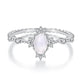 S925 sterling silver moonstone ring featuring an oval pale moonstone center and prong-set gems