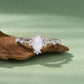 S925 sterling silver moonstone ring on wood with oval pale stone and small diamond-like details