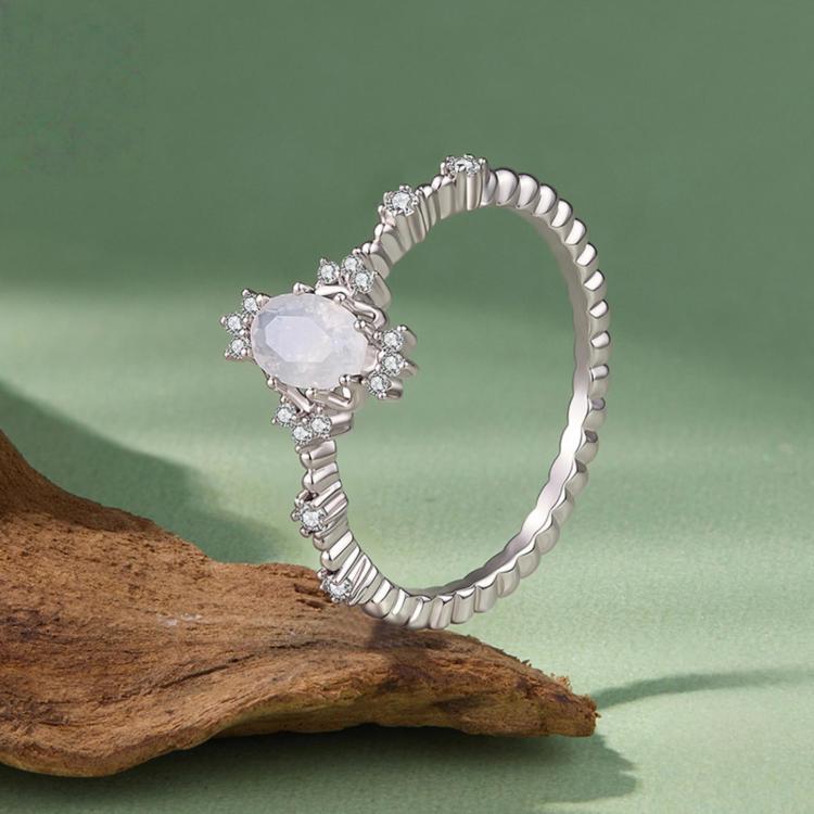 S925 sterling silver moonstone ring shown from side, with oval moonstone and cutout halo stones