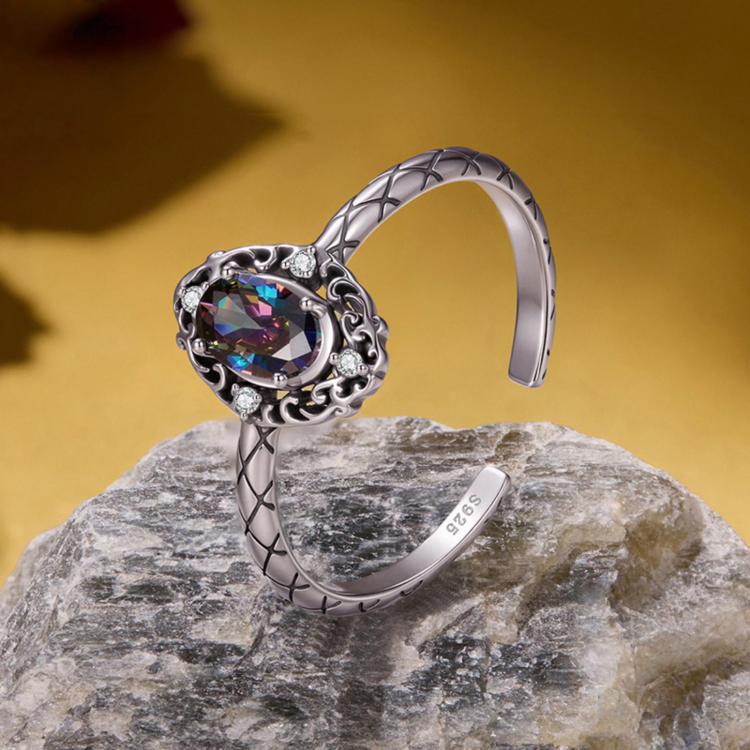 Sterling silver open ring with large oval iridescent center stone and ornate side details
