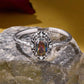 Sterling silver open ring with oval multicolor center stone and braided pattern band