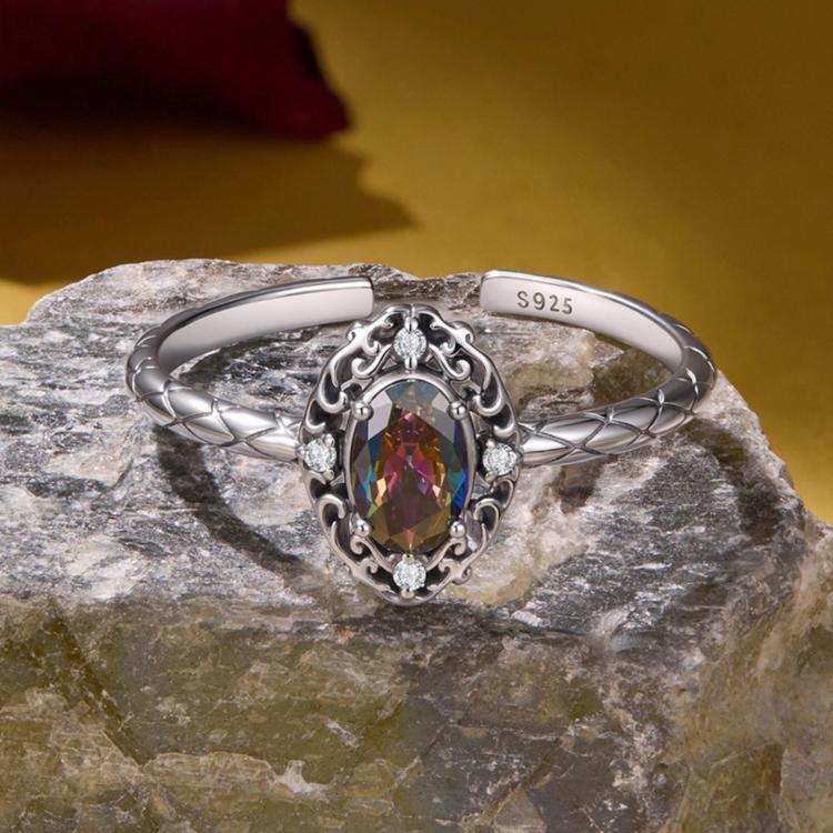 Sterling silver open ring with oval multicolor center stone and braided pattern band