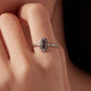 S925 silver open ring on finger with dark purple oval center stone and crystal accents