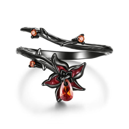 Open black-gold mandala gothic ring with red teardrop center and amber accent stones