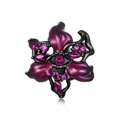 Black metal devil flower charm with magenta petals and pink gem accents