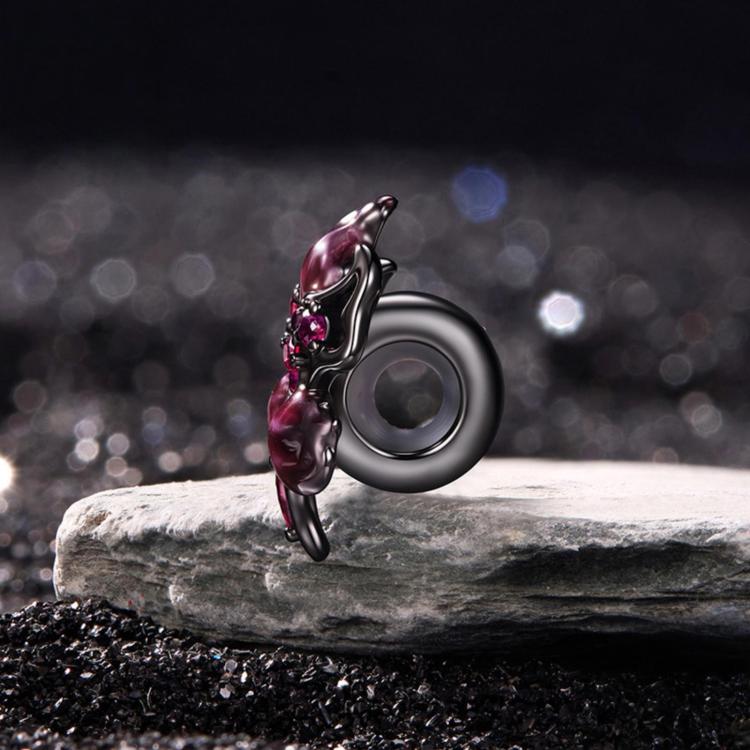 Sterling silver devil flower charm with magenta enamel petals and pink stones, side