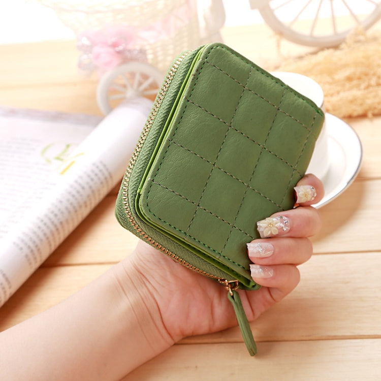 Green quilted mini coin purse with short zipper and gold-tone zipper pull