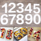 Number cake display with molds for digits 1 to 5 and decorated cake examples