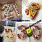 Decorated number cakes with colorful fruit and frosting on baking trays