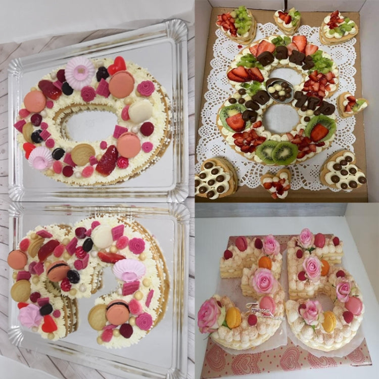 Frosted number cakes with flowers and berries arranged in two compartments