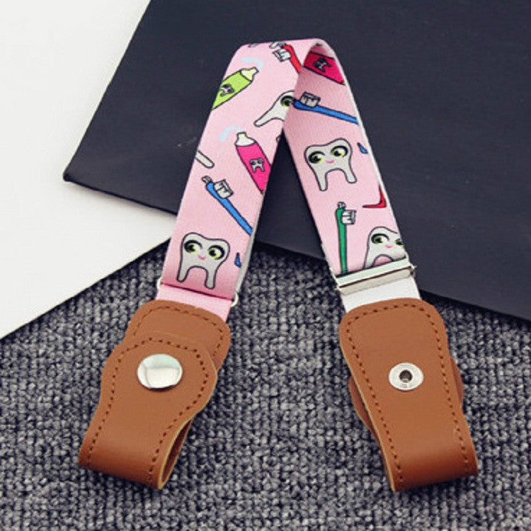 Children elastic snap belt with pink cartoon tooth pattern fabric and tan leather ends