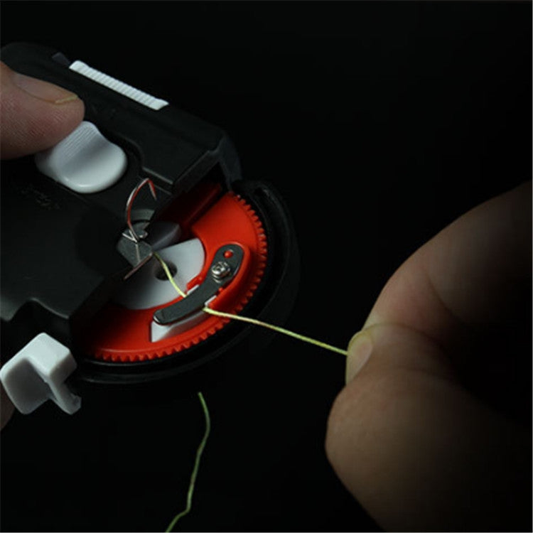 Black electric knotting device with red circular hook head while in use