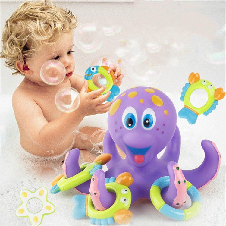 Children’s purple octopus bath water toy with green ring launcher and small figures