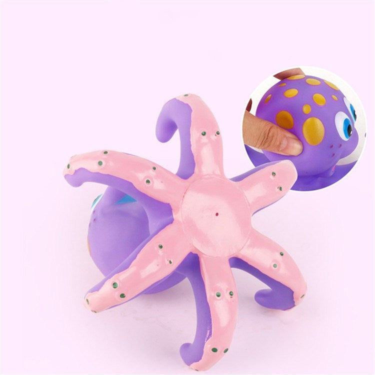 Purple octopus bath toy with pink tentacles and raised throwing circle