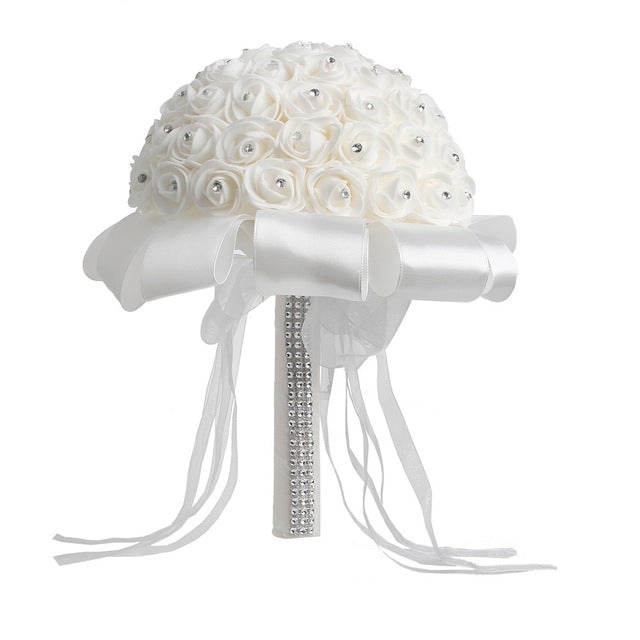 White rose-bud wedding bouquet with satin ribbons and rhinestone-wrapped handle