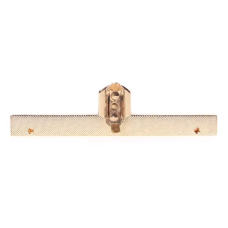 Mortise lock plate with textured bar, central keyhole, and screw holes