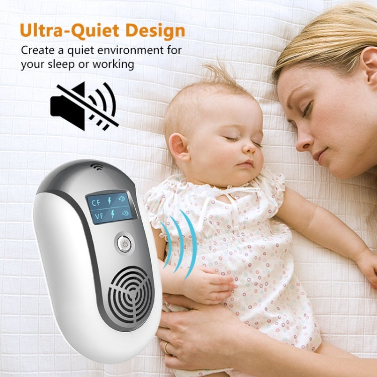 Ultrasonic pest repeller with LCD display and speaker grille, shown in room setting