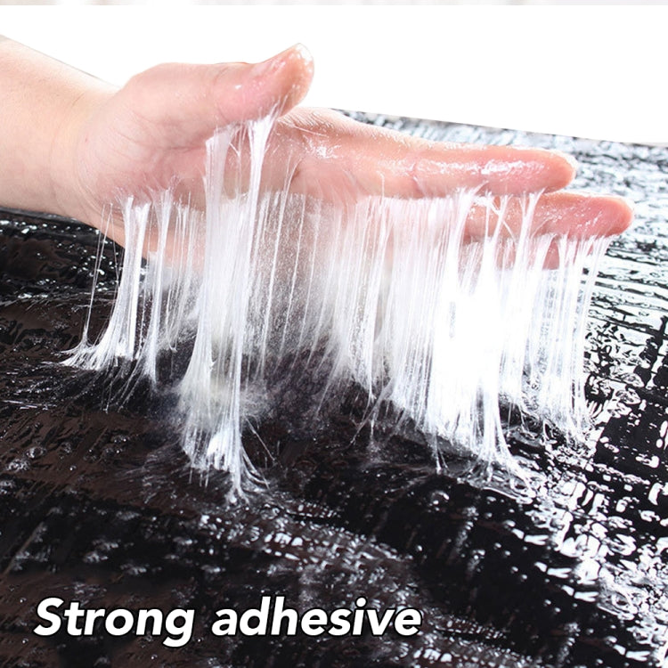 Close-up of strong adhesive on black rodent glue trap board
