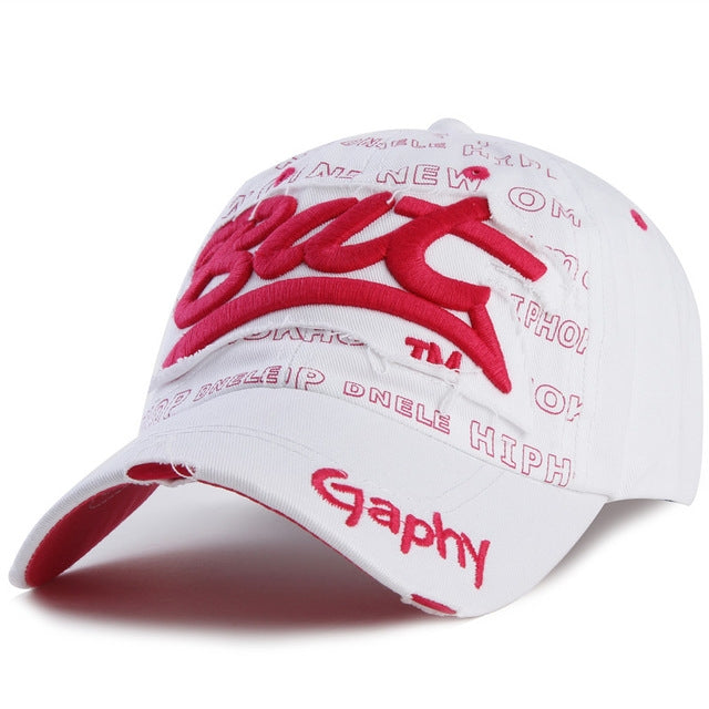 White baseball cap with red embroidered letters and curved brim, adjustable strap