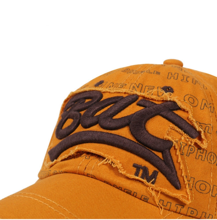 Close-up orange baseball cap with black embroidered word detail