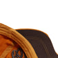 Close-up orange baseball cap brim with dark underbrim and contrast stitching