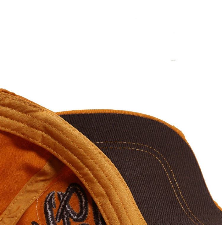 Close-up orange baseball cap brim with dark underbrim and contrast stitching