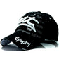 Black baseball cap with white embroidered letters and Graphy script on front
