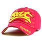 Pink baseball cap with yellow embroidered letter pattern and curved brim
