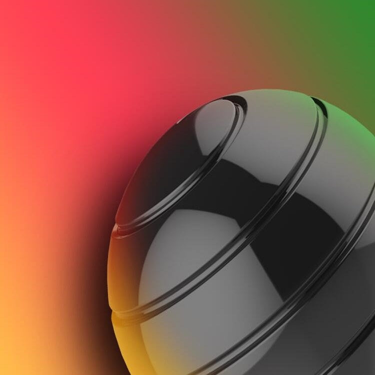 Close-up of rotating ball gyroscope toy with silver metal shell and dark band.