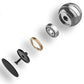 Exploded view of rotating ball gyroscope toy parts: silver dome, gold ring, black base.