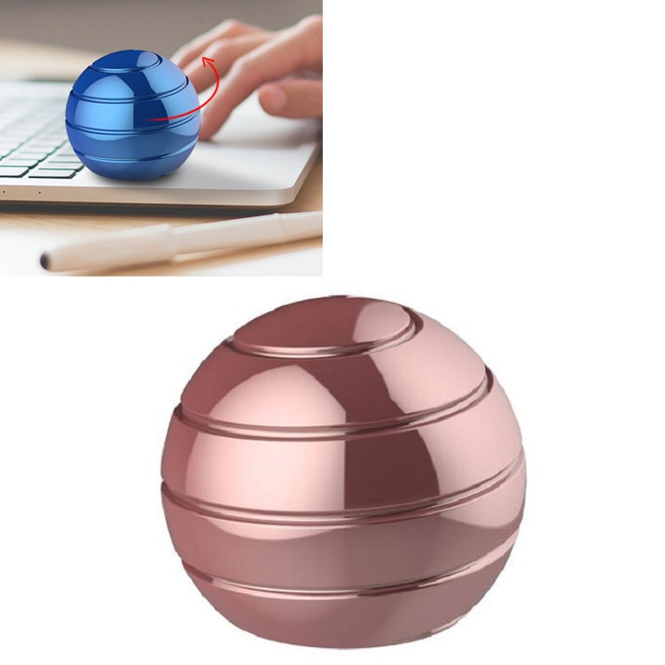 Rotating tabletop ball gyroscope toy, rose gold and small blue ball designs