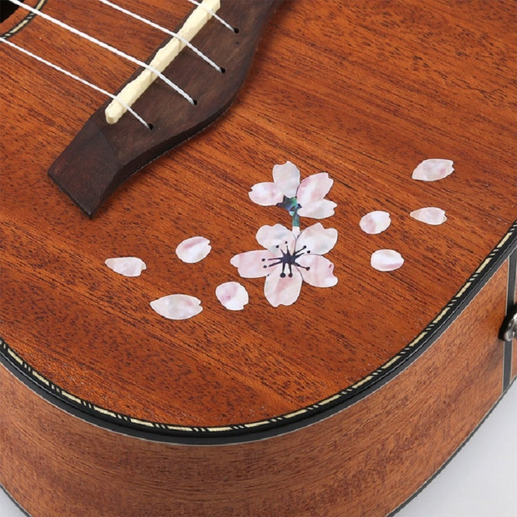 Cherry blossom flower and petal guitar stickers on brown wooden guitar top