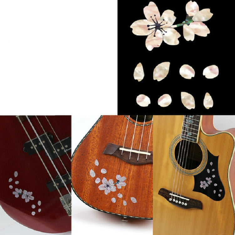 Cherry blossom guitar sticker set shown on red and wood-tone instrument bodies