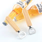 Pair of beer bottle openers with rubber wood handles lifting caps from bottles