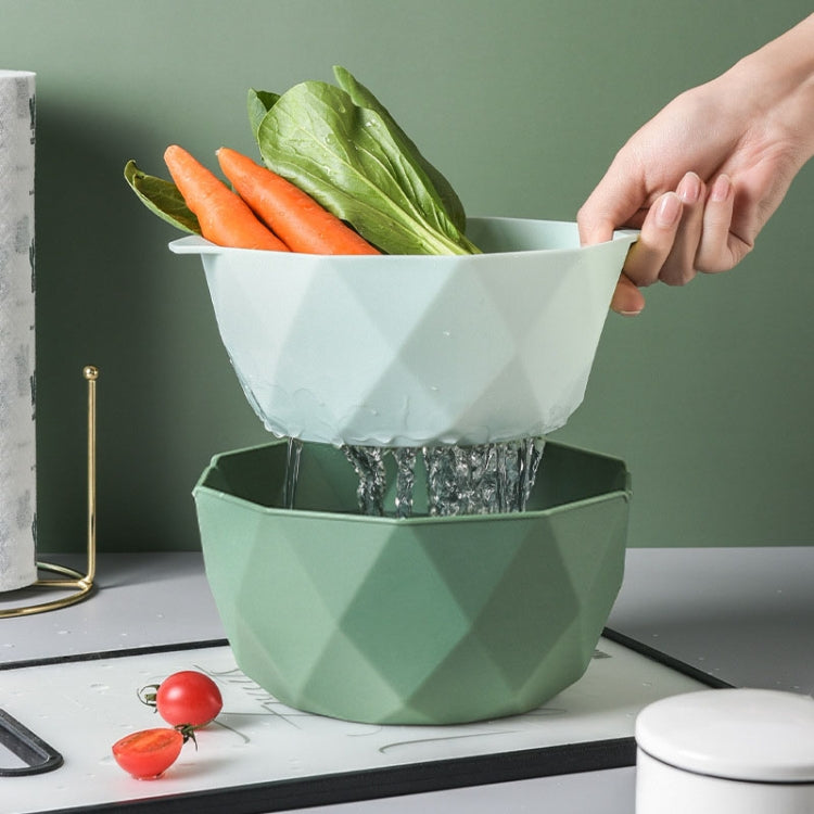 Green double-layer drain basket stack with vegetables, water draining through bottom