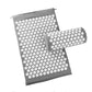 Grey acupuncture massage pad and pillow with white acupressure spikes