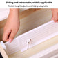 Adjustable white drawer divider with sliding track and locking clip on drawer base.