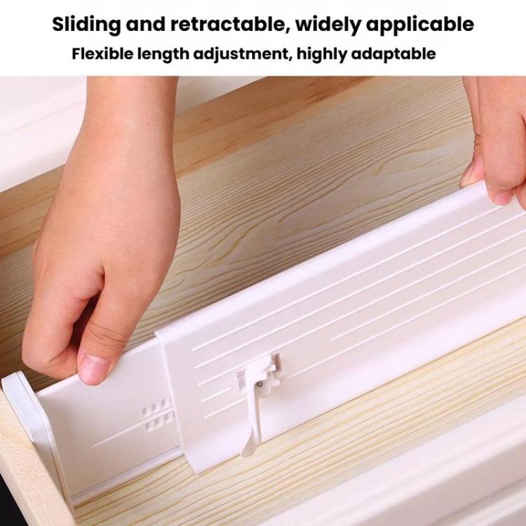 Adjustable white drawer divider with sliding track and locking clip on drawer base.