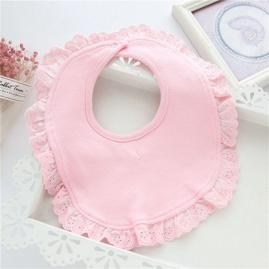 Pink lace-trim baby bib with scalloped edge and round neckline opening.