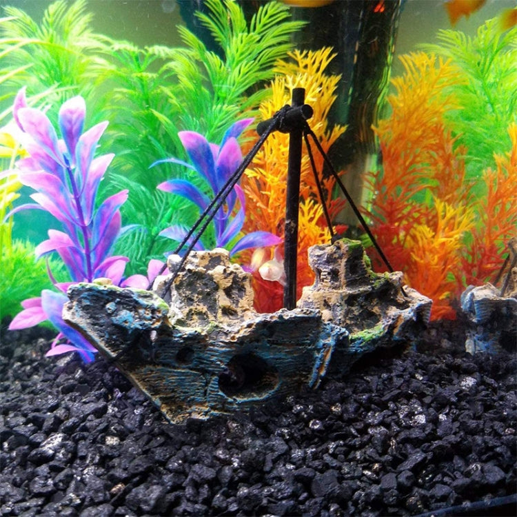 Decorative pirate ship aquarium ornament with blue-and-green hull and black rigging pole